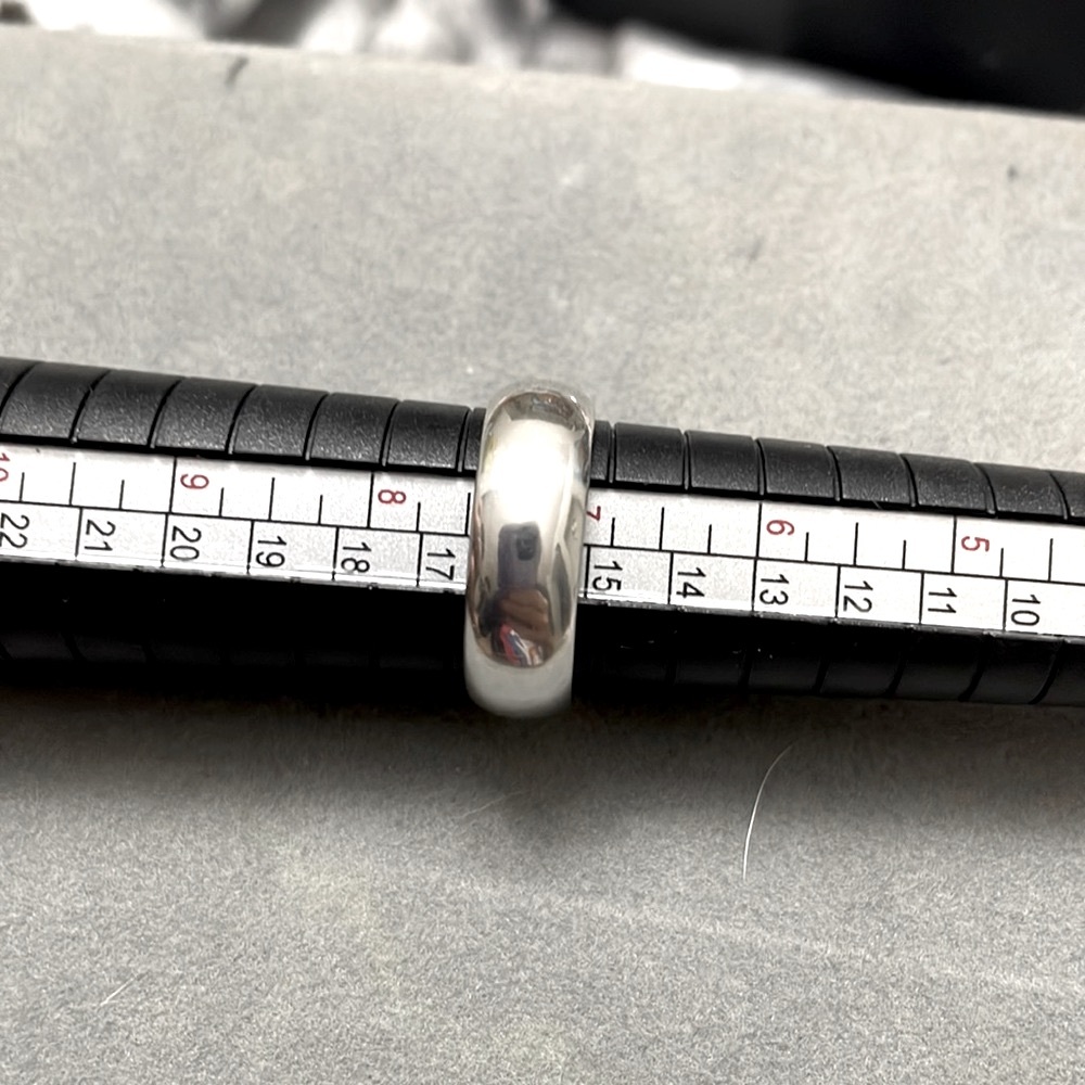 Silver ring.  This is not stamped.  Cleans with silver cloth nicely. Solid